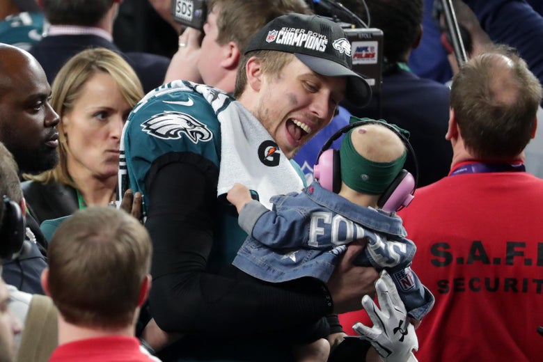 MINNEAPOLIS, MN - FEBRUARY 04: Nick Foles #9 of the Philadelphia Eagles celebrates with his daughter Lily Foles after his 41-33 victory over the New England Patriots in Super Bowl LII at U.S. Bank Stadium on February 4, 2018 in Minneapolis, Minnesota. The Philadelphia Eagles defeated the New England Patriots 41-33. (Photo by Streeter Lecka/Getty Images)